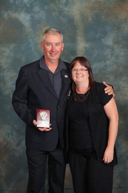 Darryn Nicholls with wife and DS award.JPG